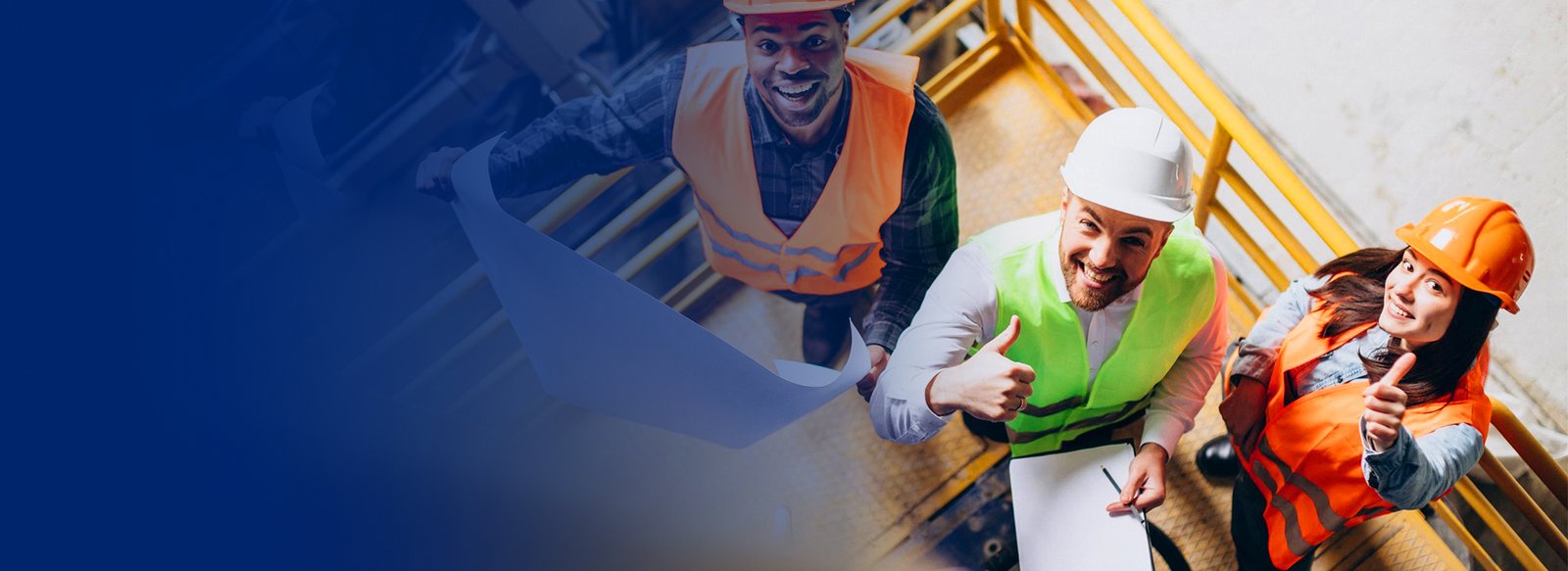 Construction workers celebrating with a thumbs up on site